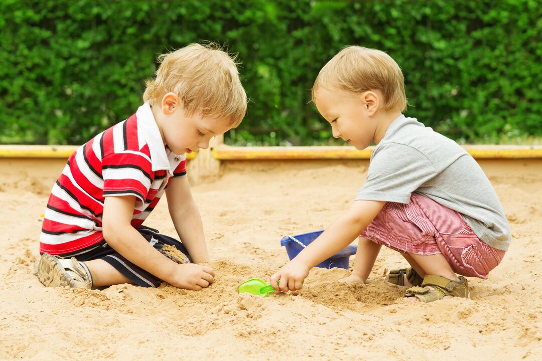 children are infected with worms in the sandbox